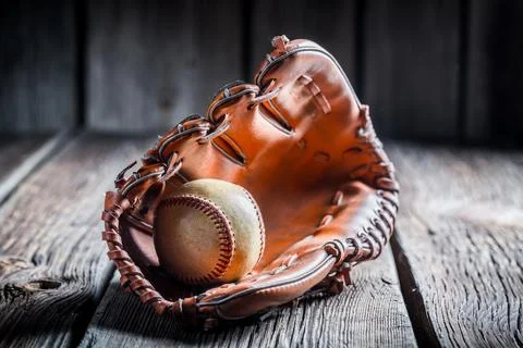 Baseball in a leather glove Stock Photos