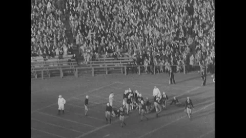 Baseball match plays out, watched over by Hoover Stock Footage 252593788