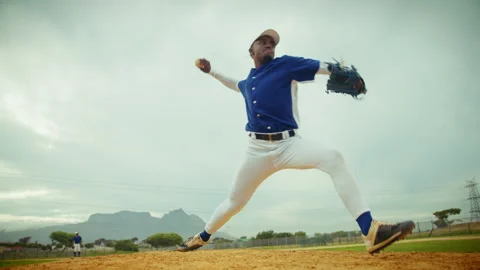 Baseball pitcher unleashes a powerful throw from the mound Stock Footage 327454785