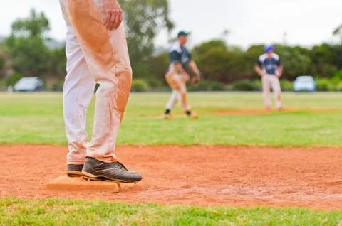 Baseball player on a base Stock Photos