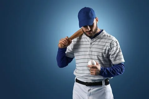 Baseball player with bat and ball in hand, sports and athletic performance, p Stock Photos