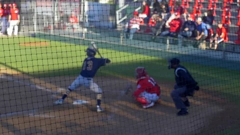 A baseball player batter catcher umpire makes a play at a game, slow motion. Stock Footage 70495259