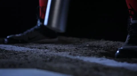 Baseball player batter taps cleats with bat, HIGH SPEED SHUTTER Stock Footage