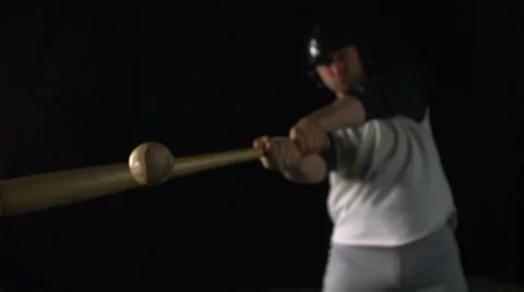Baseball player hitting ball with bat, Slow Motion Stock Footage