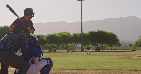 Baseball player hitting a ball during a match Stock Footage 125052731