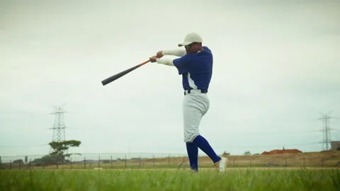 Baseball player practices batting on the field Stock Footage 336945875