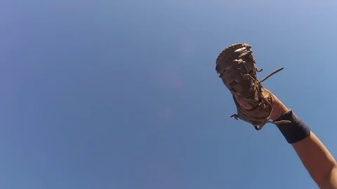 Baseball player reaching to make catch in slow motion Видео 80357869