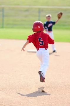 Baseball player running to second base Stock Photos