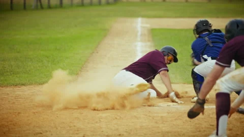 Baseball player slides into a base in action Stock Footage 331004277