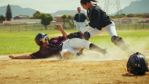 Baseball player slides into base Stock Footage 336363861