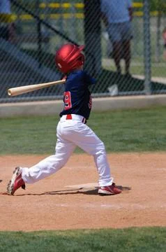 Baseball player swinging a bat Stock Photos