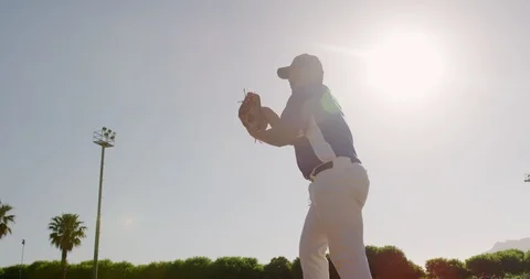 Baseball player throwing a ball during a match Stock Footage 125052701