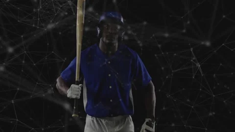 Baseball player walking into tech network grid catching bat entering frame and Stock Footage 311049399