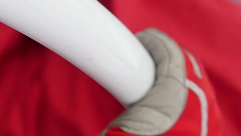 A baseball player wearing a red glove holding a white bat Video stock 274031376