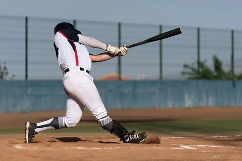 Baseball players in action on the stadium Stock Photos