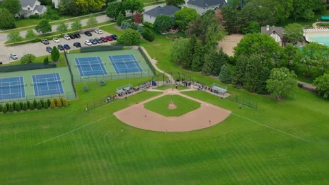 Baseball Players Playing During Match On A Sunny Day. Aerial shot footage Stock Footage 313016517
