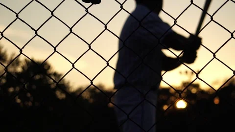 Baseball players practice at sunset  Video stock 121239128