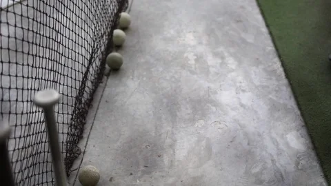 Baseball practice field shooting from the net behind with baseball bat 스톡 동영상 102821916