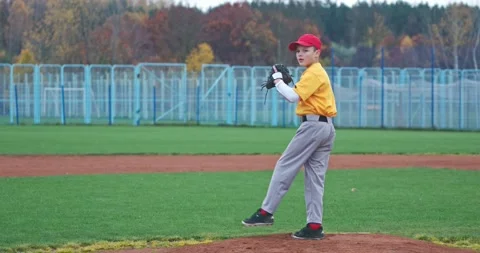 Baseball at school, the pitcher pitches fastball toward batter, boy throwing  Stock Footage 143703442