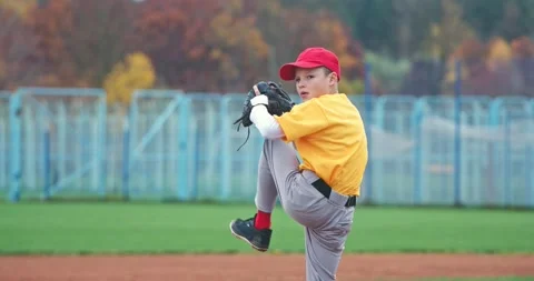 Baseball at school, the pitcher pitches fastball toward batter, young boy Stock Footage 143759127