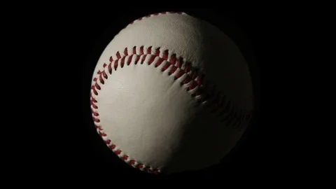Baseball Spinning Over Black Video stock 83496950