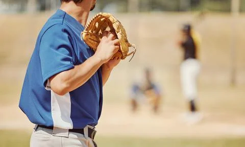 Baseball, sports and pitcher with a ball and glove to throw or pitch at a match Stock Photos