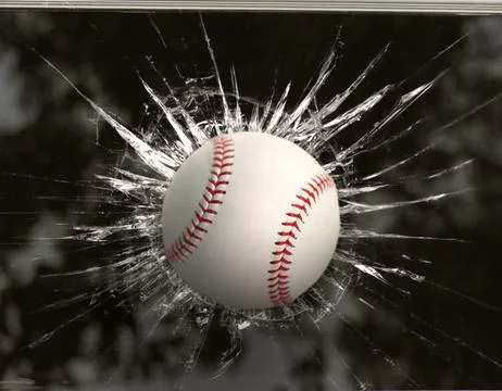 Baseball through broken window Stock Photos