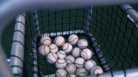 Baseballs in Netting During Practice Warm Up Stock Footage 86261365