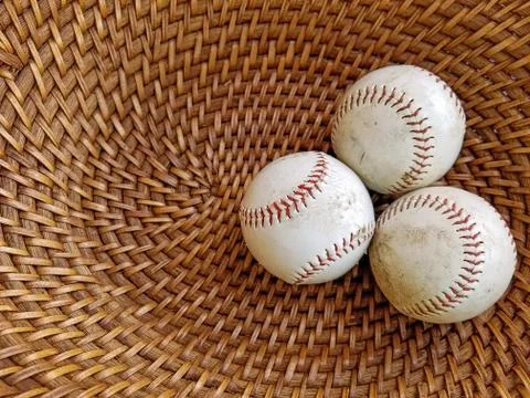 Baseballs in wicker basket Stock Photos