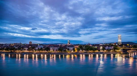 Basel skyline with, river, waterfront, sky with clouds in the evening timelapse Stock Footage 54884931
