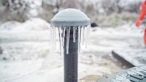 Basement ventilation in icicles in winter. Ice-fired pipe of air flow into the Stock Footage 167050543
