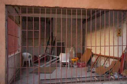 Basement warehouse cage with old rusty bars Stock Photos