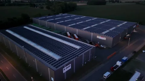 BASF Warehouse building in German suburb at dusk. Modern solar panels on roof Stock Footage 315201977