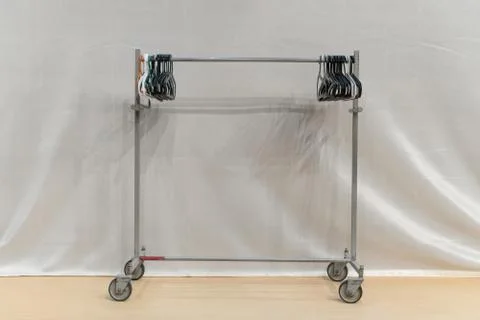 Basic adjustable garment clothing rack with hangers. wardrobe isolated on whi Fotos Stock
