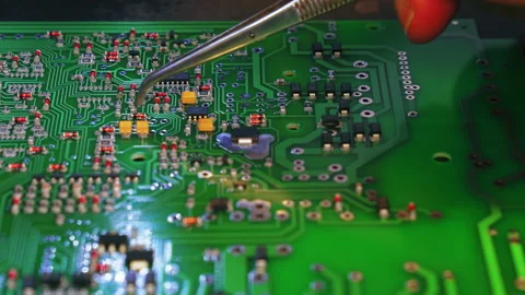 Basic components of modern electric devices. Manual montage of little pieces Stock Footage 221544830