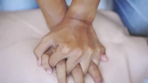 Basic CPR training resuscitation emergency breathing Performing CPR Stock Footage 322109923