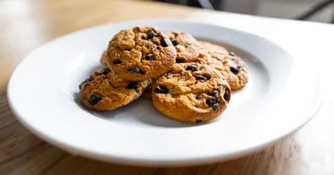 Basic drop cookies with chocolate morsels. Choc chip cookies in a white plate Stock Photos