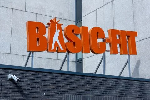 Basic-Fit logo sign at the gym.. Stock Photos