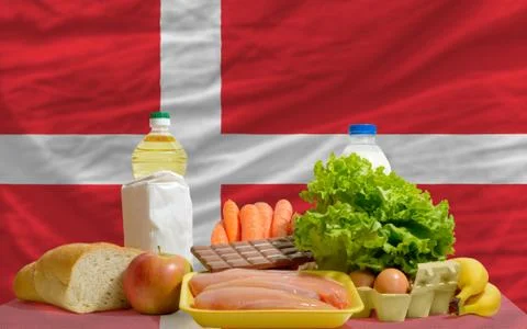 Basic food groceries in front of denmark national flag 写真素材