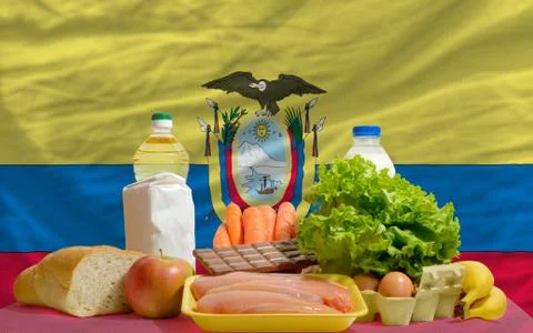 Basic food groceries in front of ecuador national flag Foto stock