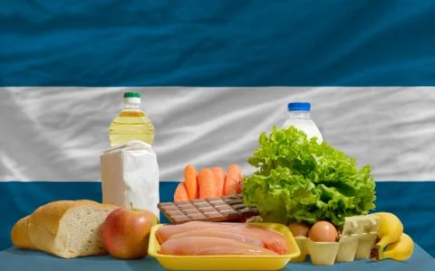 Basic food groceries in front of el salvador national flag 写真素材