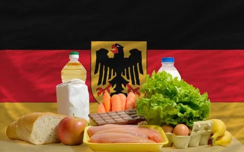 Basic food groceries in front of germany national flag Foto stock