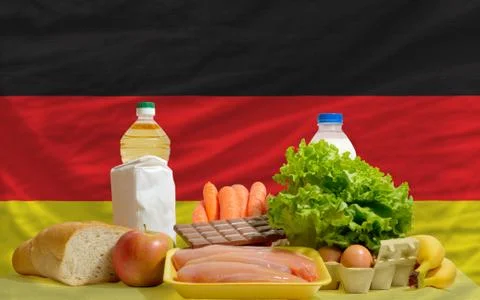 Basic food groceries in front of germany national flag Stock Photos