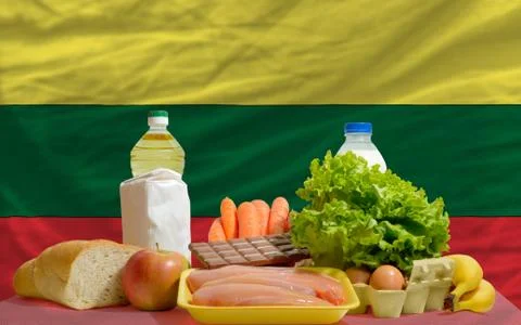 Basic food groceries in front of lithuania national flag 写真素材