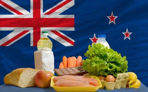 Basic food groceries in front of new zealand national flag Foto stock
