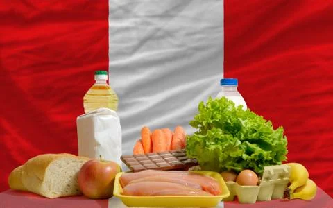 Basic food groceries in front of peru national flag 写真素材