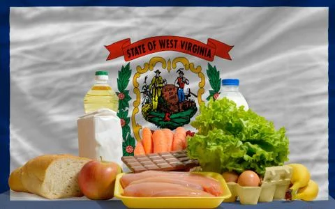 Basic food groceries in front of west virginia us state flag Stock Photos