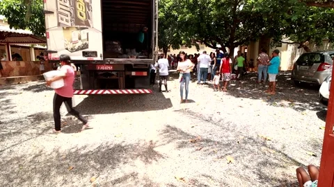 Basic Food Kit Distribution in Planaltina Goias Stock Footage 254505758