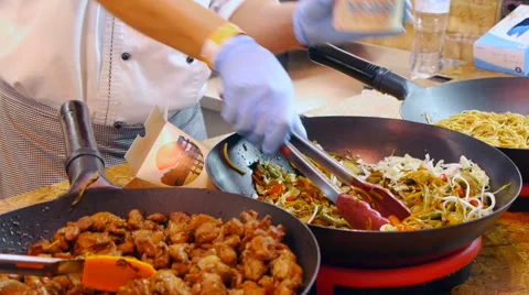 Basic ingredients for Chinese noodles cook pours in paper box and mixes them Stock Footage 67998962