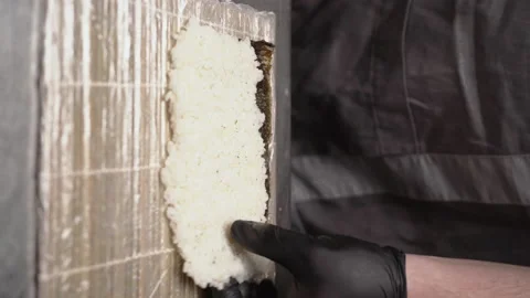 Basic ingredients for sushi. Sushi master turns sushi rolls, close up on hands Video stock 237495768